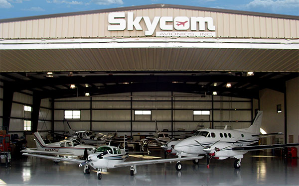 Skycom's open all-steel hangar with aircraft inside its installation space